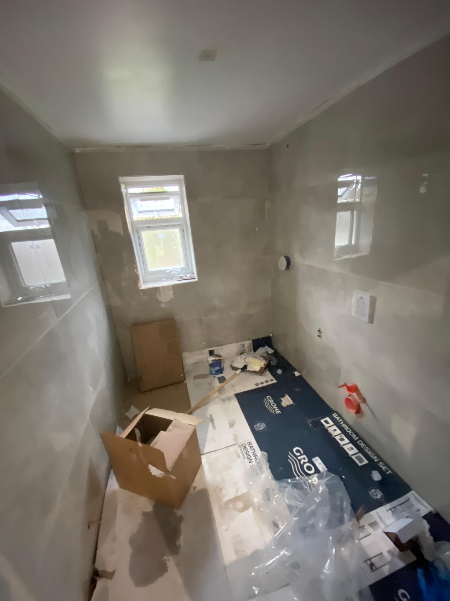 Bathroom shell — freshly plastered