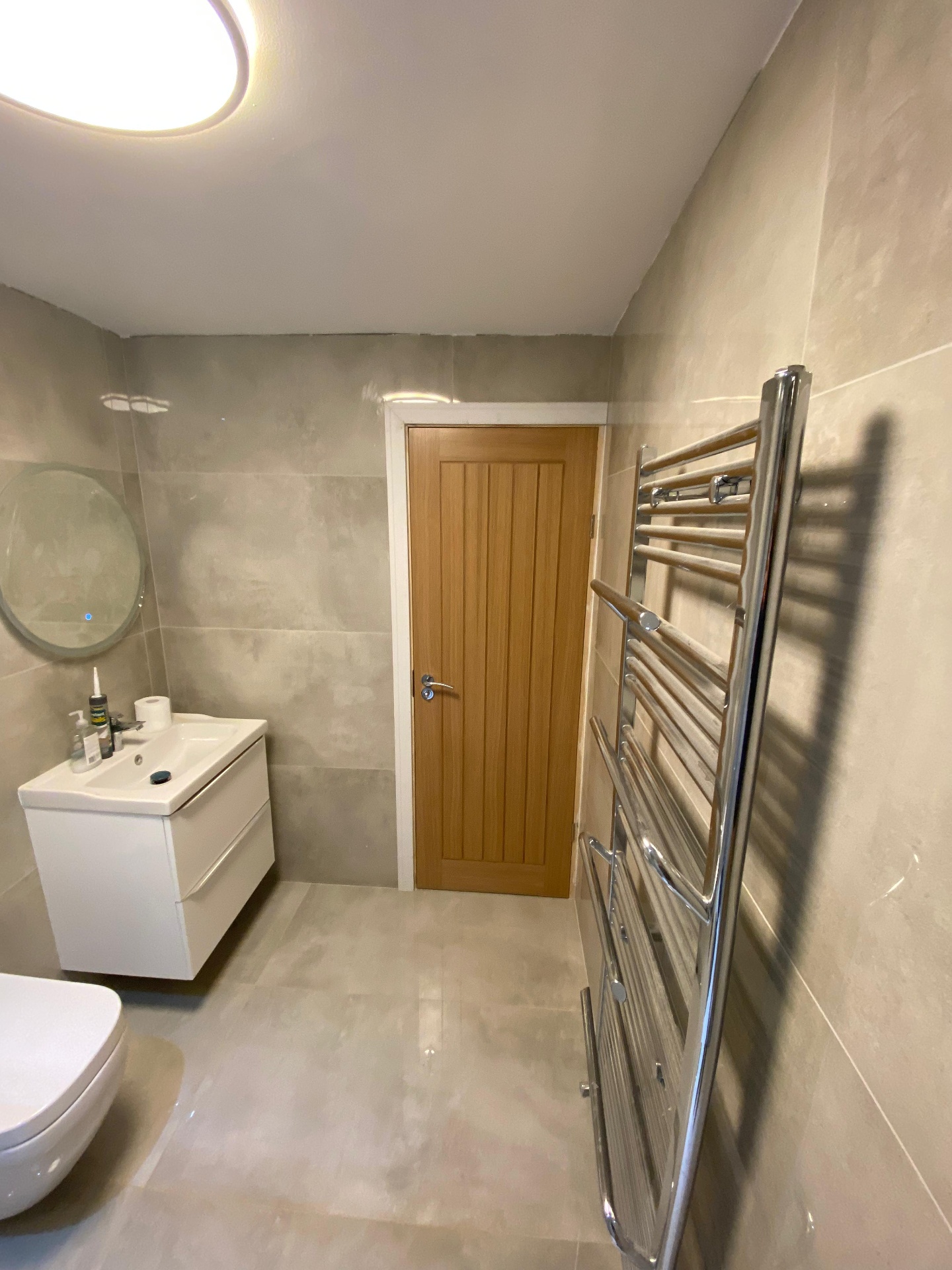Marble ensuite — vanity & shower detail